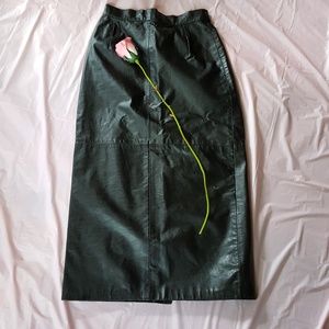 Vintage..Black leather skirt. mid length. NWOT